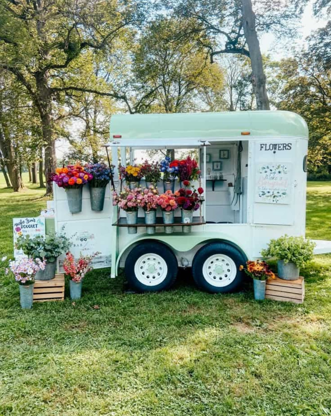 Boots Floral Co. market trailer at a community event